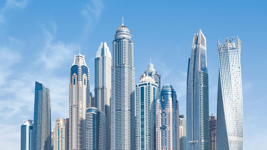pexels-photo-618079-618079 Stunning view of Dubai's iconic skyscrapers under a clear blue sky.